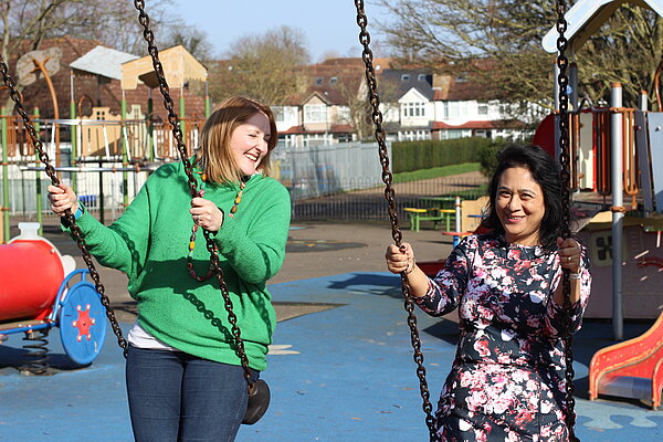 Jenna and Luni on swings